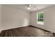 A bedroom featuring a window, ceiling fan, and wood-look floors at 2227 Charlotte Hwy, York, SC 29745