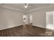 A large bedroom with a ceiling fan and a view of the kitchen and bathroom at 2227 Charlotte Hwy, York, SC 29745