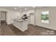 A kitchen with an island, stainless appliances, and white cabinets at 2227 Charlotte Hwy, York, SC 29745