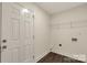 The mud room has dark floors, white walls, and a wire rack shelf at 2227 Charlotte Hwy, York, SC 29745