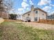 Spacious backyard with a wooden fence and patio area at 2609 Lamp Post Ln, Kannapolis, NC 28081