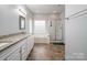Main bathroom with double vanity and a large soaking tub at 2609 Lamp Post Ln, Kannapolis, NC 28081