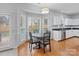Kitchen breakfast nook with bay window and hardwood floors at 2609 Lamp Post Ln, Kannapolis, NC 28081