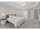 Spacious main bedroom with wood bed frame and en suite bathroom at 2609 Lamp Post Ln, Kannapolis, NC 28081