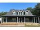 Two-story house with gray siding, a covered porch, and dormer windows at 2661 Saluda Rd, Chester, SC 29706