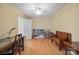 Home office featuring hardwood floors, built-in shelving, and ceiling fan at 3131 9Th Street Ne Dr # 16, Hickory, NC 28601