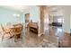 Bright dining room with wooden table and chairs, adjacent to the living room at 324 Prosperous Path, Locust, NC 28097