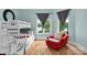 Cozy bedroom with bunk beds, lake view, and a comfortable armchair at 3255 Lake Pointe Dr, Belmont, NC 28012