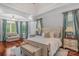 Spacious primary bedroom with hardwood floors and large windows at 3255 Lake Pointe Dr, Belmont, NC 28012