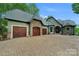 Stunning curb appeal, three-car garage, and a brick driveway at 3255 Lake Pointe Dr, Belmont, NC 28012