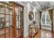 Elegant hallway with hardwood floors and French doors at 3255 Lake Pointe Dr, Belmont, NC 28012