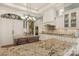 Spacious kitchen with white cabinets, granite island, and a large pantry at 3255 Lake Pointe Dr, Belmont, NC 28012