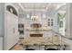 Large kitchen with white cabinets, granite island, and high-end appliances at 3255 Lake Pointe Dr, Belmont, NC 28012
