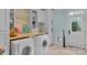 Convenient laundry room with built-in cabinets and washer and dryer at 3255 Lake Pointe Dr, Belmont, NC 28012