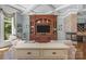 Living room with built-in shelving, fireplace, and lake views at 3255 Lake Pointe Dr, Belmont, NC 28012