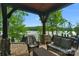 Covered patio with lake views and comfortable seating at 3255 Lake Pointe Dr, Belmont, NC 28012