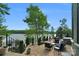 Lake view patio with seating area and hot tub at 3255 Lake Pointe Dr, Belmont, NC 28012