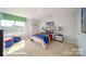 Charming bedroom with a bed, nightstand, and large window at 3680 Charles Nw St, Conover, NC 28613