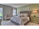 Main bedroom with tufted headboard and sitting area at 3686 Charles Nw St, Conover, NC 28613