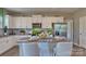Modern kitchen with white cabinets, granite countertops, and stainless steel appliances at 3686 Charles Nw St, Conover, NC 28613