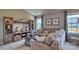 Relaxing living room with sectional sofa, built-in shelving, and large window at 3686 Charles Nw St, Conover, NC 28613