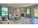 Cozy living room featuring a fireplace and green accent curtains at 3686 Charles Nw St, Conover, NC 28613