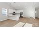 Modern kitchen featuring white cabinets and a breakfast bar at 4115 Pebblebrook Sw Cir, Concord, NC 28027