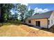 Exterior view of the home and backyard that includes a partial fence, and sliding glass door at 4119 Pebblebrook Sw Cir, Concord, NC 28027