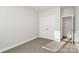 Bright bedroom featuring neutral walls and a double door closet at 4119 Pebblebrook Sw Cir, Concord, NC 28027