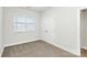 Bright bedroom with neutral walls, carpet flooring, and double door closet at 4119 Pebblebrook Sw Cir, Concord, NC 28027