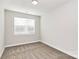 Spacious bedroom with neutral carpeting and large window at 4119 Pebblebrook Sw Cir, Concord, NC 28027