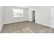 Well-lit bedroom with carpet and access to a bathroom at 4119 Pebblebrook Sw Cir, Concord, NC 28027