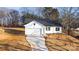 Newly constructed home with white siding and a dark roof at 4119 Pebblebrook Sw Cir, Concord, NC 28027