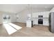 Bright kitchen with white cabinets, stainless steel appliances, and island at 4119 Pebblebrook Sw Cir, Concord, NC 28027