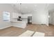 Modern kitchen featuring white cabinetry and a breakfast bar at 4119 Pebblebrook Sw Cir, Concord, NC 28027