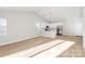 Open concept kitchen with white cabinets and stainless steel appliances at 4119 Pebblebrook Sw Cir, Concord, NC 28027