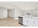 Open living room with LVP flooring and sliding glass door to backyard at 4119 Pebblebrook Sw Cir, Concord, NC 28027