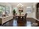 Elegant dining room with hardwood floors and large windows at 4624 Pebble Run Dr, Matthews, NC 28105