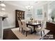 Elegant dining room, hardwood floors, and seating for six at 4624 Pebble Run Dr, Matthews, NC 28105