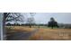 Property with a long driveway and open pasture at 4921 Cr Wood Rd, Gastonia, NC 28056