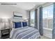 Bedroom with a double bed and ample natural light at 6028 Fonsac Ln # 2005C, Charlotte, NC 28217