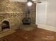 Living room featuring a brick fireplace and wood floors at 605 W Mountain St, Kings Mountain, NC 28086