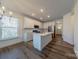 Modern kitchen with island, white cabinets, and stainless steel appliances at 6806 Harris Bay Rd, Charlotte, NC 28269