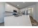 Modern kitchen with white cabinets, quartz countertops and island at 6806 Harris Bay Rd, Charlotte, NC 28269