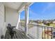 Second story balcony with black wrought iron railings has seating and community views at 7150 Irongate Dr, Indian Land, SC 29707