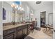 Spa-like bathroom with dual vanities, granite countertops, and a separate glass enclosed shower at 7150 Irongate Dr, Indian Land, SC 29707