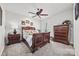 Bedroom with wood furniture, carpet flooring, ceiling fan, and natural light from a window at 7150 Irongate Dr, Indian Land, SC 29707