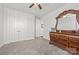 Spacious bedroom with plush carpet, ceiling fan, and white trim has walk in closet at 7150 Irongate Dr, Indian Land, SC 29707