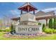 Elegant entrance sign for the Bent Creek community with beautiful landscaping at 7150 Irongate Dr, Indian Land, SC 29707