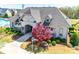 A view of the clubhouse at 7135 Irongate Drive featuring beautiful landscaping at 7150 Irongate Dr, Indian Land, SC 29707